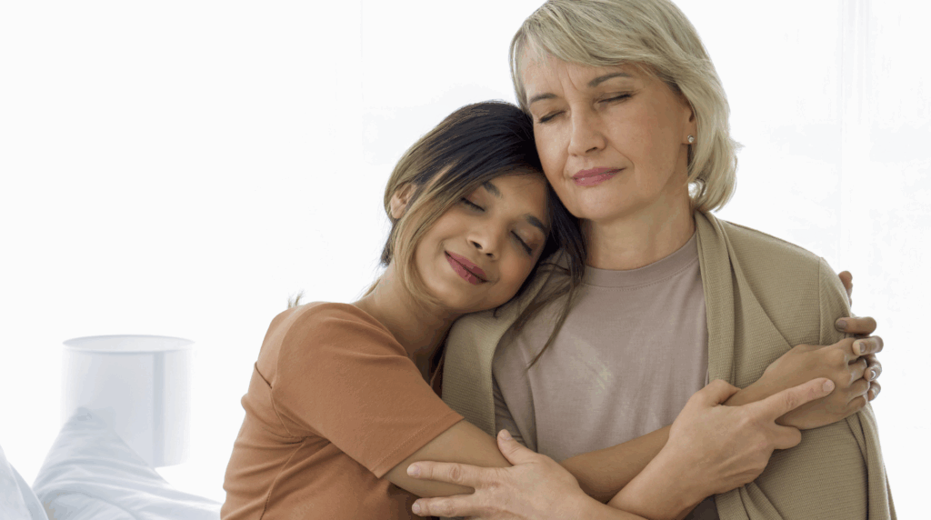 Two women embracing affectionately, symbolizing family bonding and support, relevant to the theme of stepparent adoption in Texas.