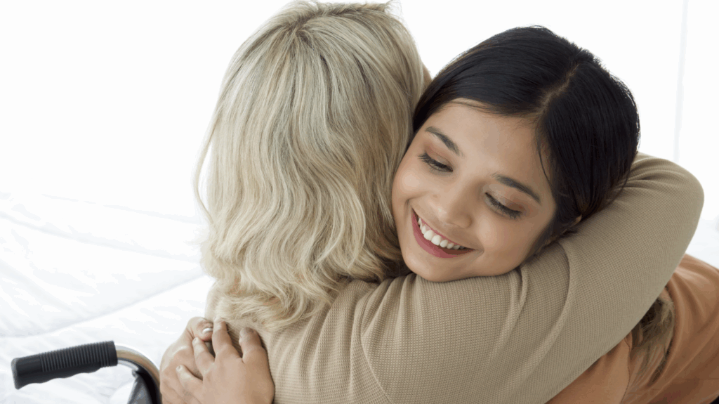 Two women embracing warmly, conveying love and support, symbolizing the emotional connection in the adoption process.