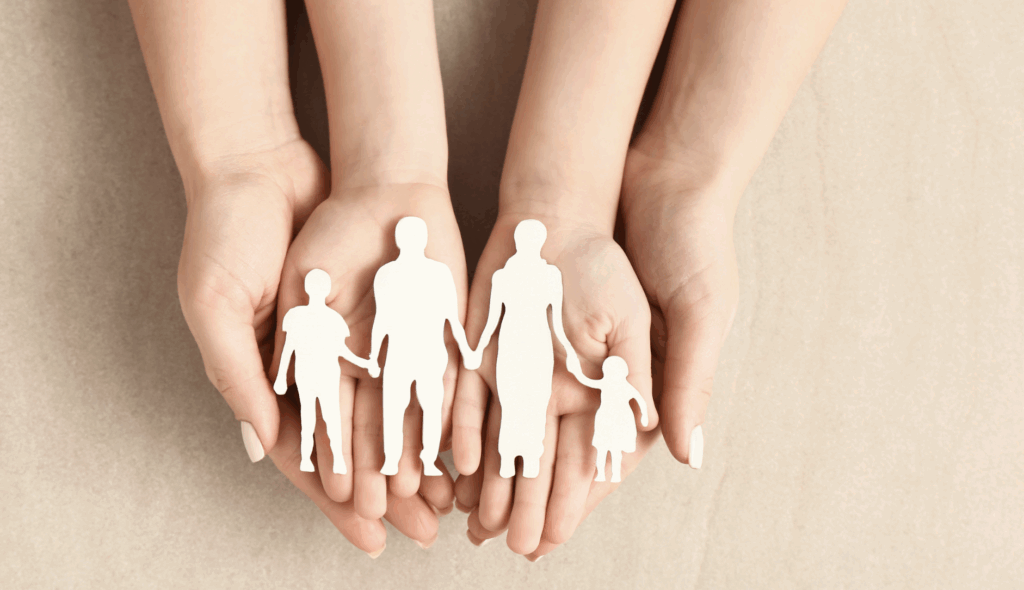 Hands holding silhouettes of a family, symbolizing adoption and family unity, relevant to Texas adoption resources and legal guidance.